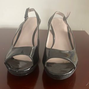 Beautiful hsrdly worn black  patent leather peep toe . Great condition.